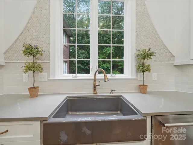 a kitchen with a sink and a window
