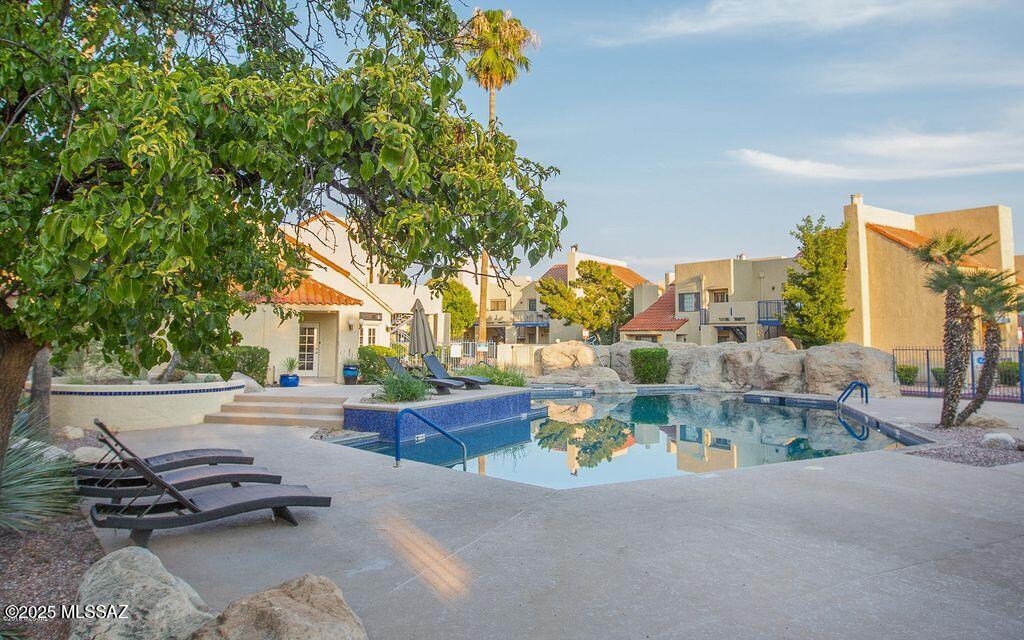 1200 East River Road, Unit B27 Tucson, AZ 85718 - Photo 4 of 40 an outdoor view with patio