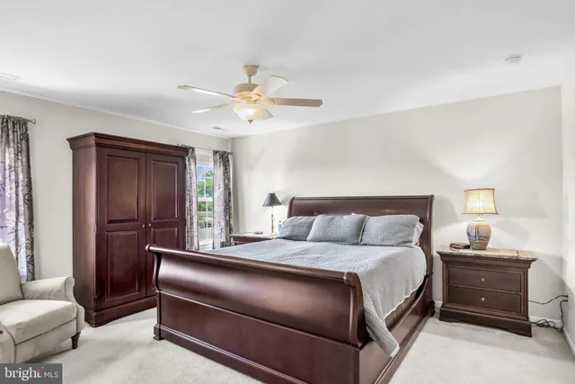 a white bath tub sitting next to a shower