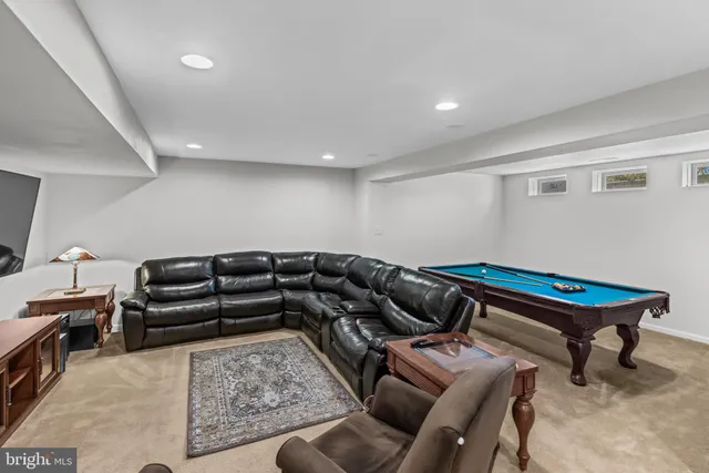 an aerial view of a house with outdoor space and lake view