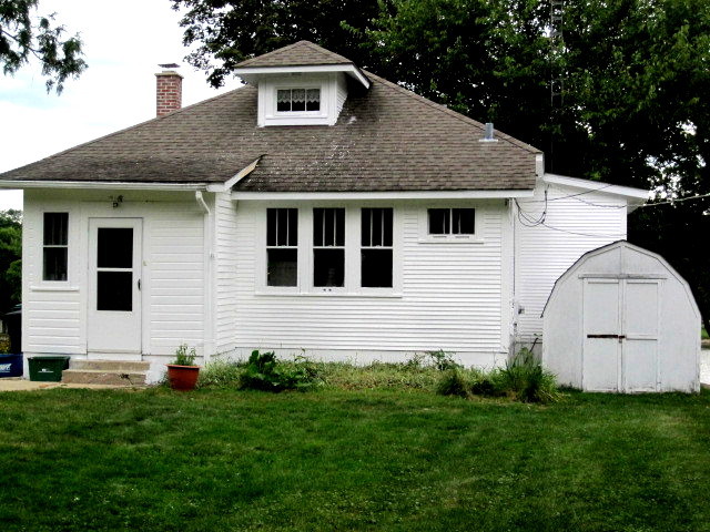 6N284 Riverside Drive St. Charles, IL 60174 - Photo 1 of 26 a front view of a house with a yard