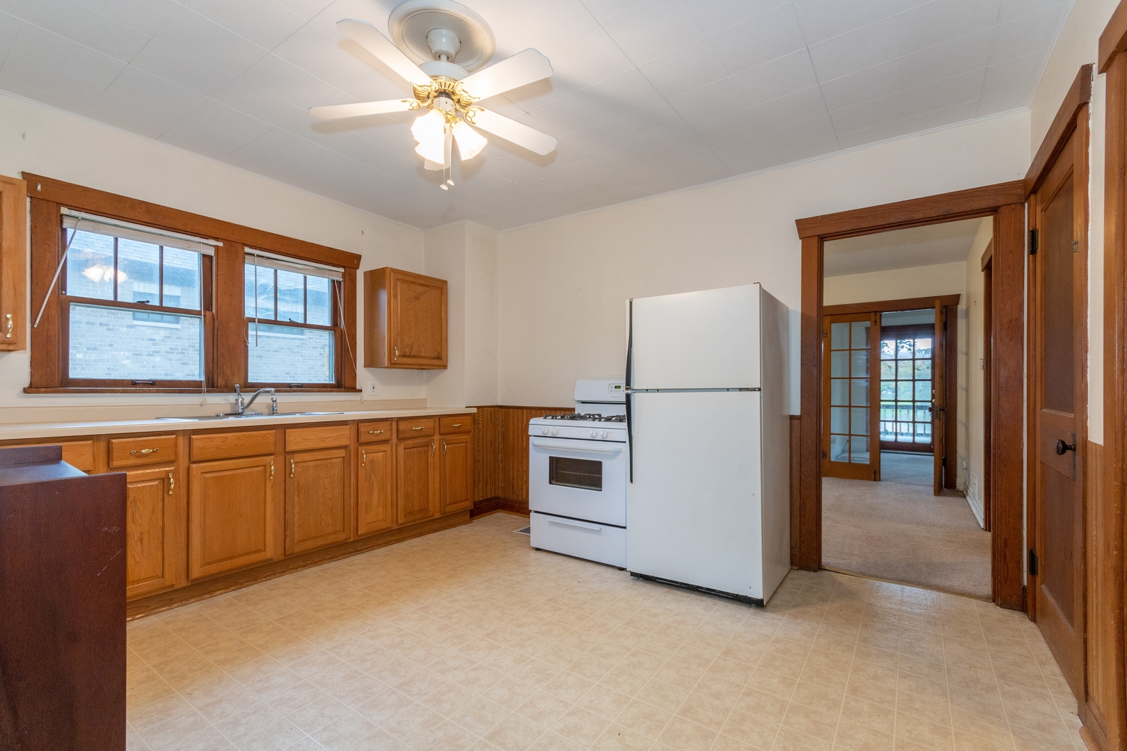 6N284 Riverside Drive St. Charles, IL 60174 - Photo 8 of 26 a kitchen with stainless steel appliances granite countertop a stove a sink dishwasher a refrigerator and a dining table with wooden floor