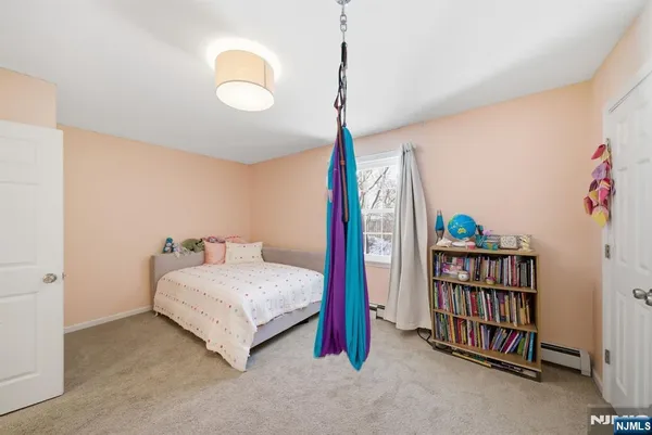 a bedroom with a bed and a book shelf