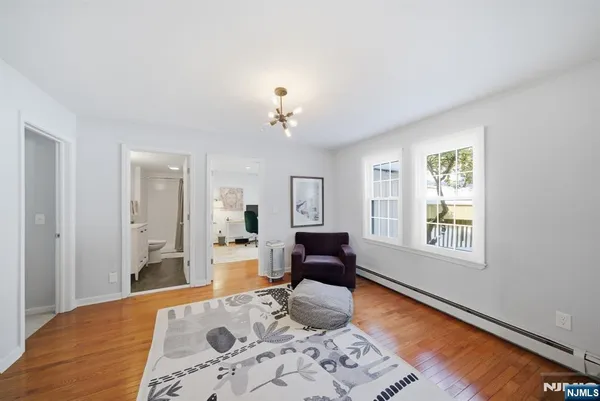 a bedroom with furniture and a window