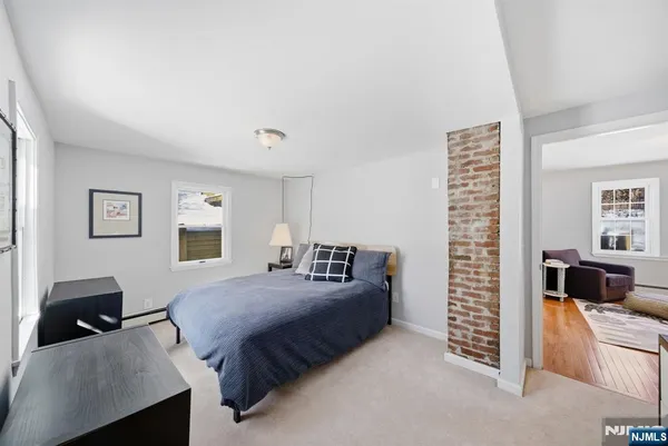 a bedroom with bed and a couch