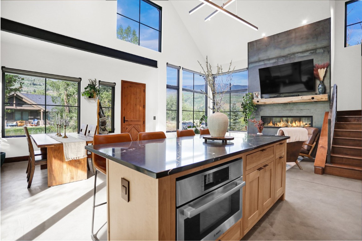 150 Game Trail Road Silverthorne, CO 80498 - Photo 11 of 47 a kitchen with stainless steel appliances a stove a sink and a microwave