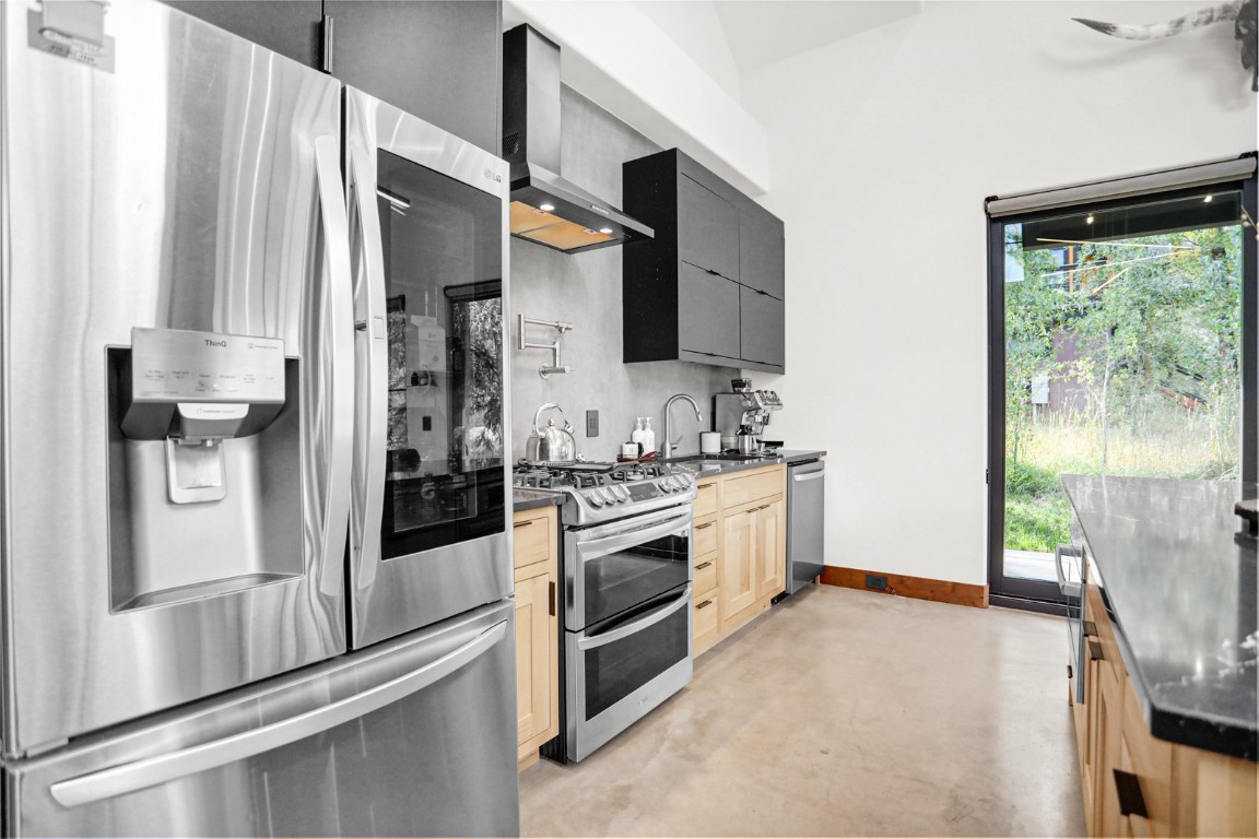 150 Game Trail Road Silverthorne, CO 80498 - Photo 12 of 47 a kitchen with stainless steel appliances a refrigerator sink and stove