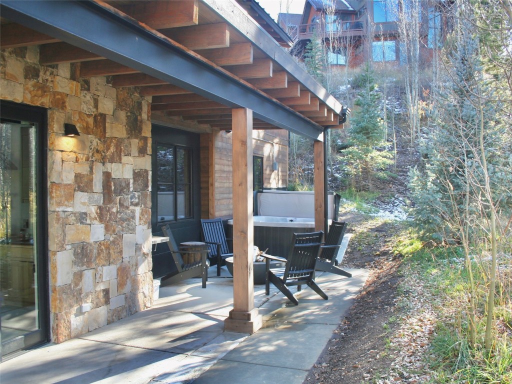 150 Game Trail Road Silverthorne, CO 80498 - Photo 15 of 47 a view of patio with table and chairs and potted plants