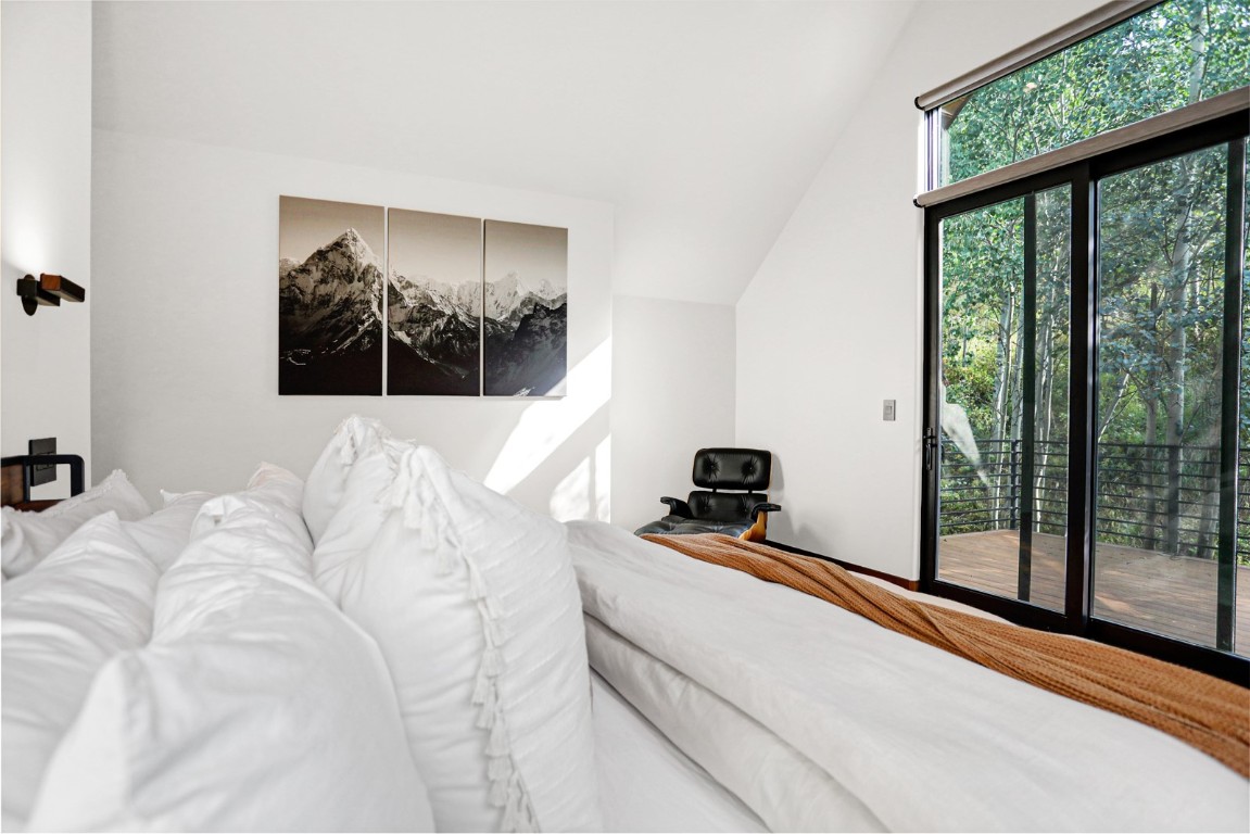150 Game Trail Road Silverthorne, CO 80498 - Photo 19 of 47 a bed room with a bed and a large window