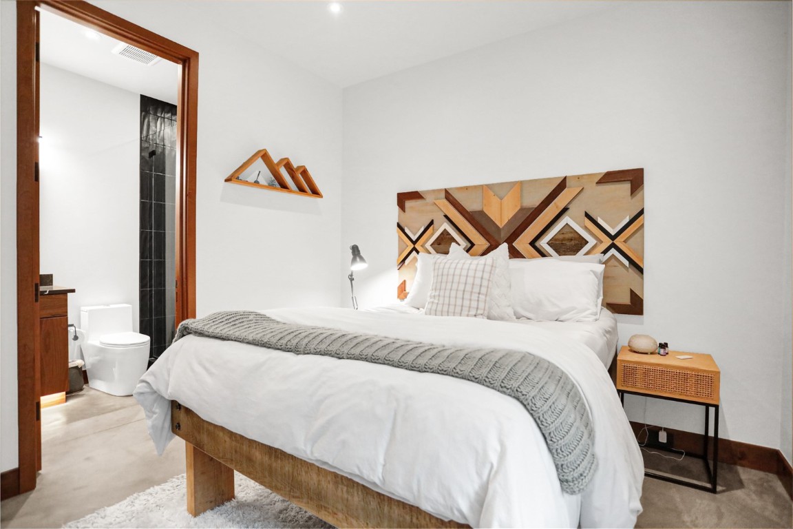 150 Game Trail Road Silverthorne, CO 80498 - Photo 25 of 47 a bedroom with a bed and painting on the wall