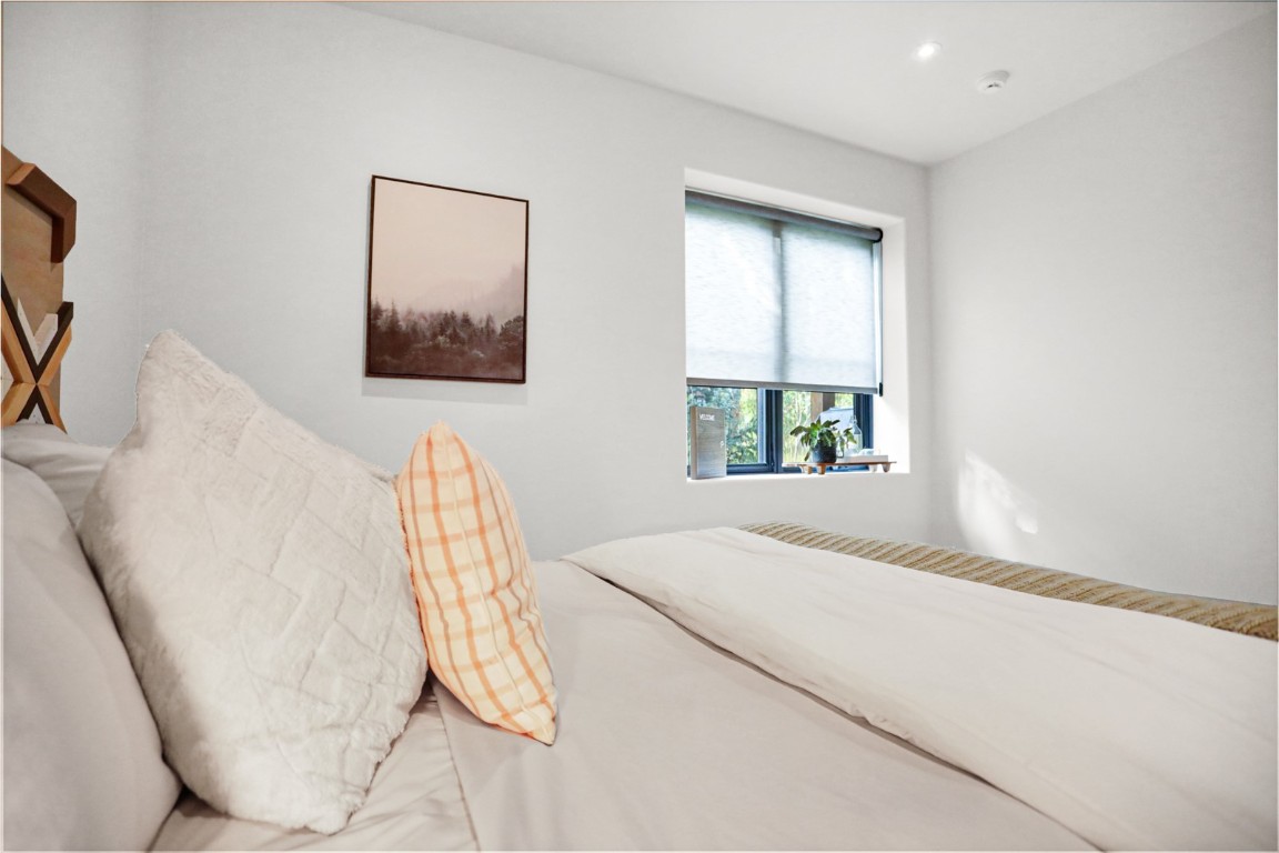 150 Game Trail Road Silverthorne, CO 80498 - Photo 26 of 47 a bedroom with a bed and a window