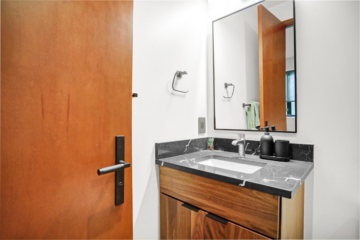 150 Game Trail Road Silverthorne, CO 80498 - Photo 28 of 47 a bathroom with a granite countertop sink and a mirror