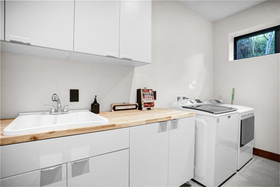 150 Game Trail Road Silverthorne, CO 80498 - Photo 36 of 47 a kitchen with stainless steel appliances granite countertop a sink a stove and white cabinets