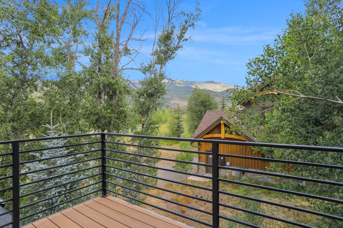 150 Game Trail Road Silverthorne, CO 80498 - Photo 44 of 47 a view of a balcony with wooden floor and fence