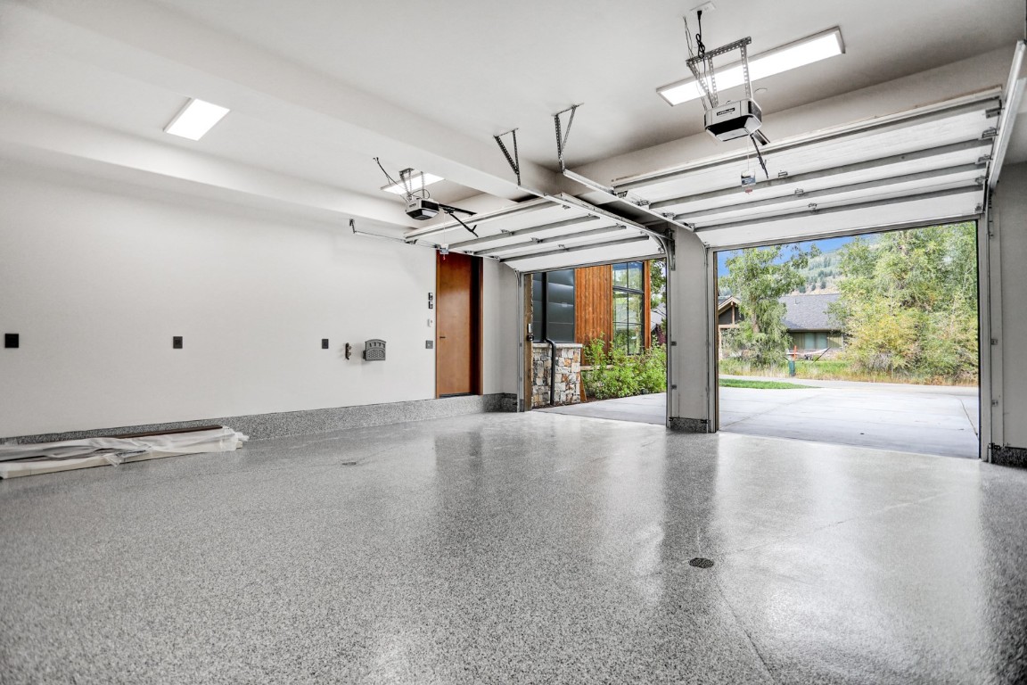 150 Game Trail Road Silverthorne, CO 80498 - Photo 45 of 47 a view of a livingroom with a fireplace a ceiling fan and wooden floor