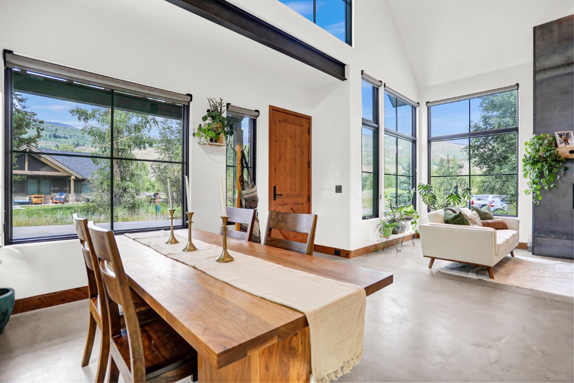 150 Game Trail Road Silverthorne, CO 80498 - Photo 5 of 47 a living room with furniture and large windows