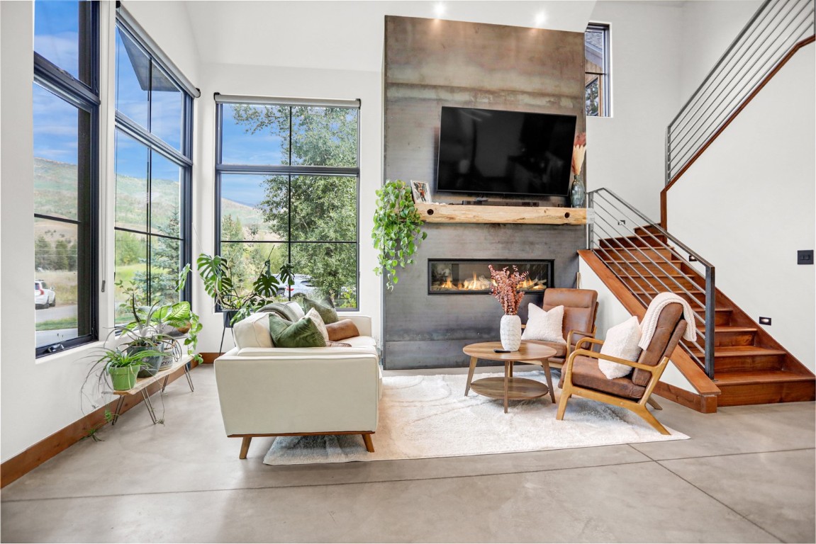 150 Game Trail Road Silverthorne, CO 80498 - Photo 6 of 47 a living room with furniture and a flat screen tv