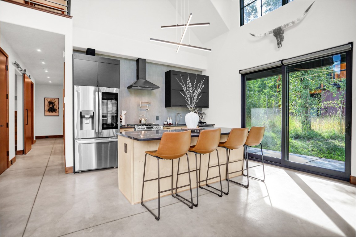 150 Game Trail Road Silverthorne, CO 80498 - Photo 8 of 47 a kitchen with stainless steel appliances granite countertop a refrigerator and a stove top oven