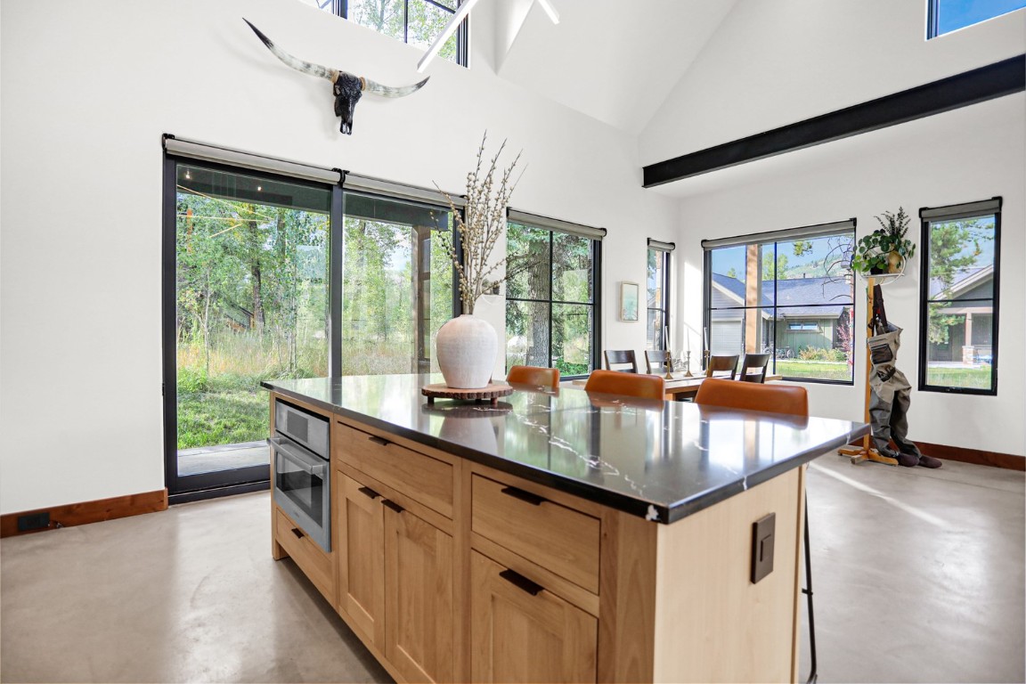 150 Game Trail Road Silverthorne, CO 80498 - Photo 9 of 47 a kitchen with center island and windows