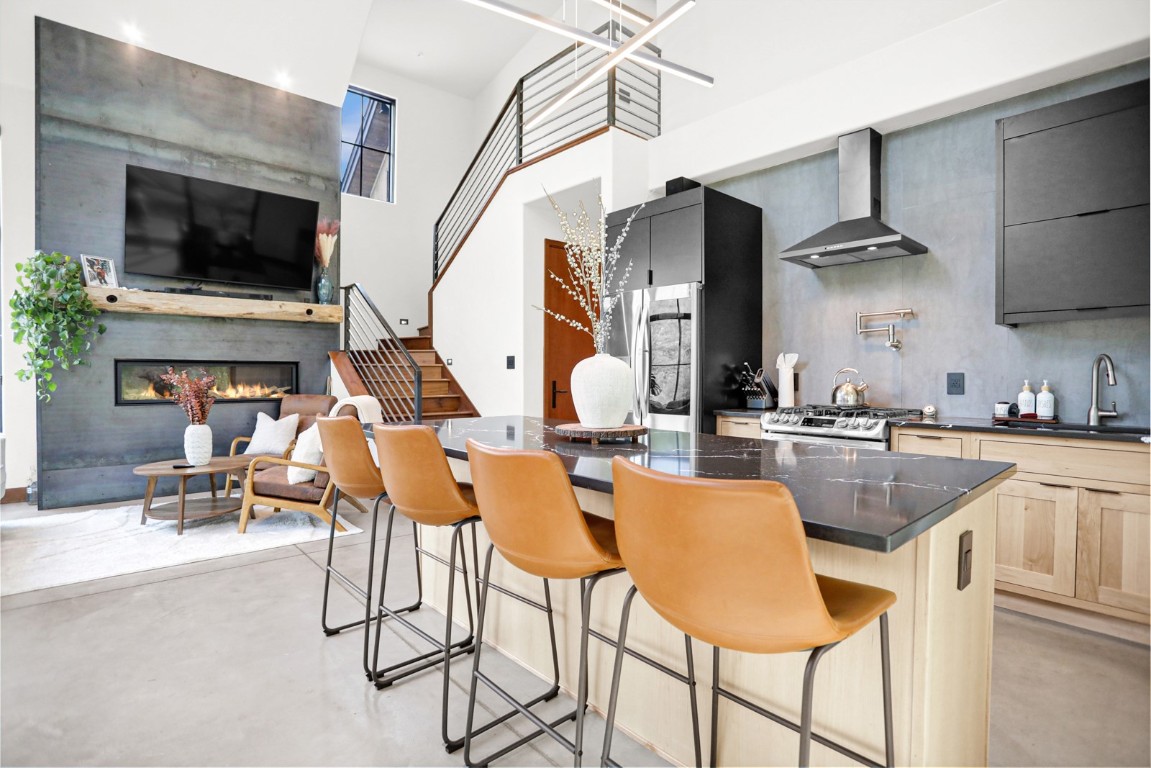 150 Game Trail Road Silverthorne, CO 80498 - Photo 10 of 47 a kitchen with stainless steel appliances kitchen island granite countertop a table and chairs in it