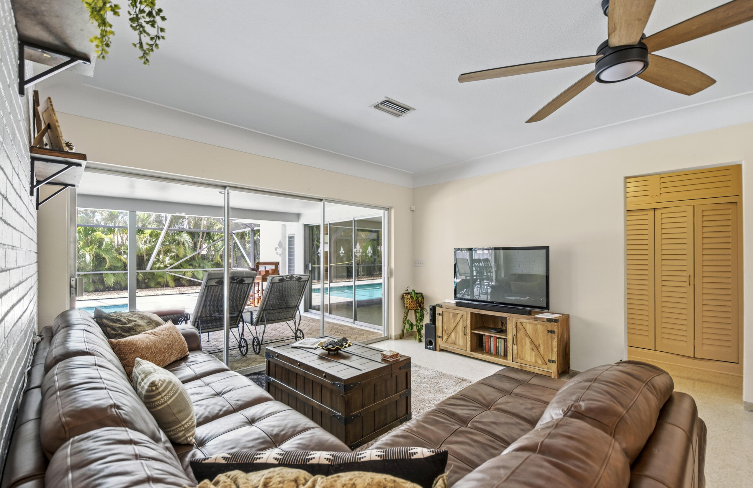 1348 Southwest 4th Street Boca Raton, FL 33486 - Photo 5 of 44 a living room with furniture and a flat screen tv