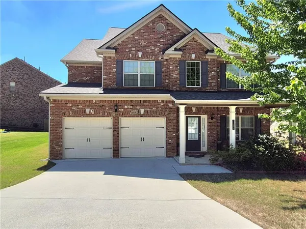 front view of a house with a yard