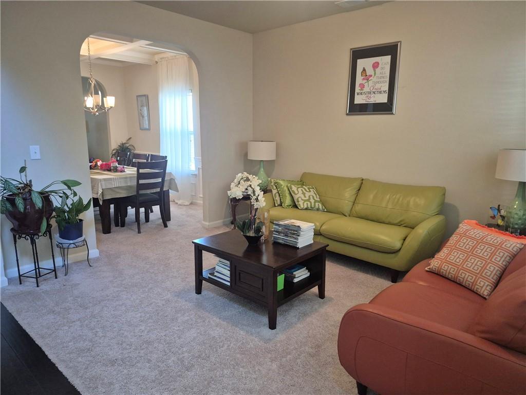 2269 Reddy Farm Lane Grayson, GA 30017 - Photo 13 of 46 a living room with furniture and a potted plant