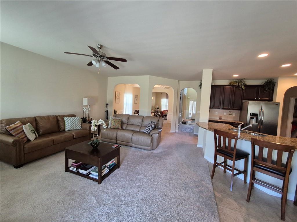 2269 Reddy Farm Lane Grayson, GA 30017 - Photo 17 of 46 a living room with furniture and a view of kitchen
