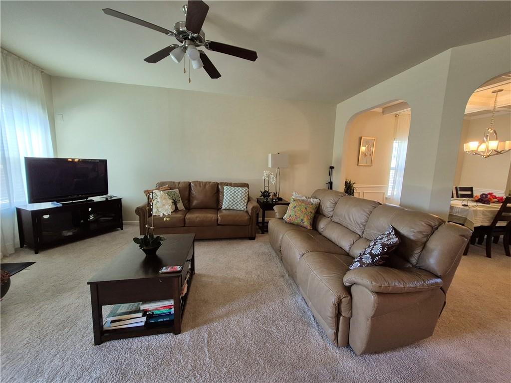 2269 Reddy Farm Lane Grayson, GA 30017 - Photo 19 of 46 a living room with furniture and a flat screen tv
