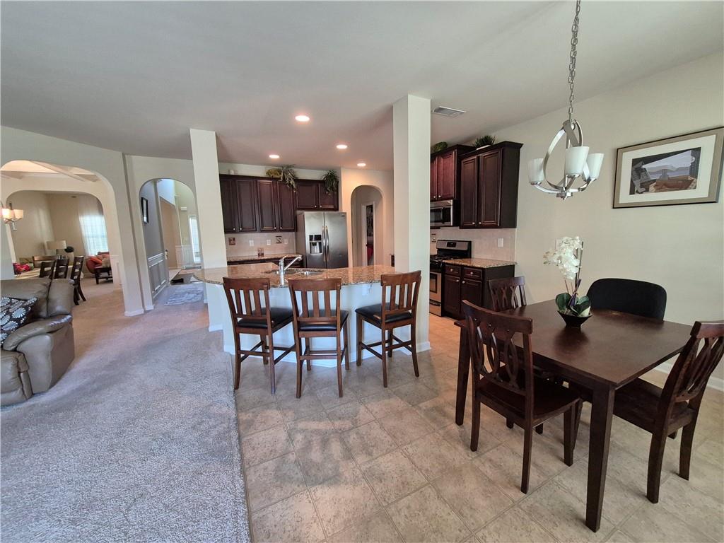 2269 Reddy Farm Lane Grayson, GA 30017 - Photo 24 of 46 a view of a dining room with furniture