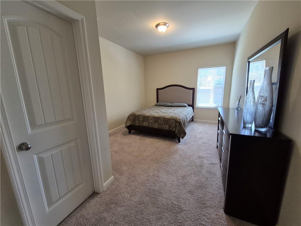 2269 Reddy Farm Lane Grayson, GA 30017 - Photo 26 of 46 a living room with furniture and a gate
