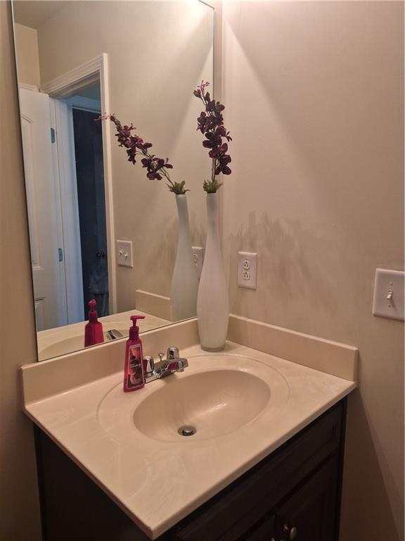 2269 Reddy Farm Lane Grayson, GA 30017 - Photo 28 of 46 a bathroom with a sink vanity and a mirror