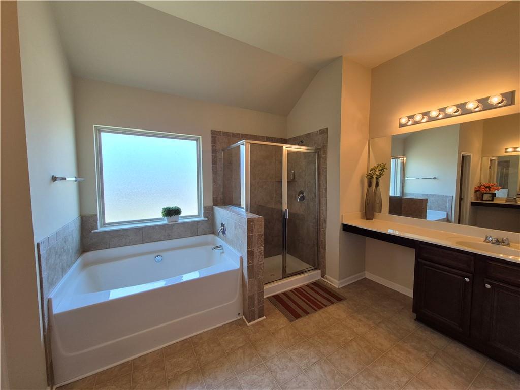 2269 Reddy Farm Lane Grayson, GA 30017 - Photo 40 of 46 a spacious bathroom with a tub and a sink