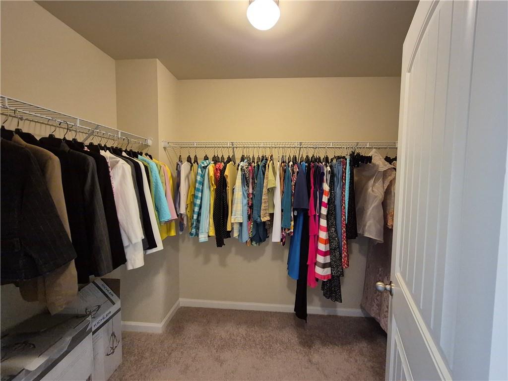 2269 Reddy Farm Lane Grayson, GA 30017 - Photo 41 of 46 a view of walk in closet with clothes
