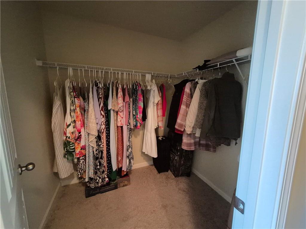 2269 Reddy Farm Lane Grayson, GA 30017 - Photo 42 of 46 a view of walk in closet with clothes