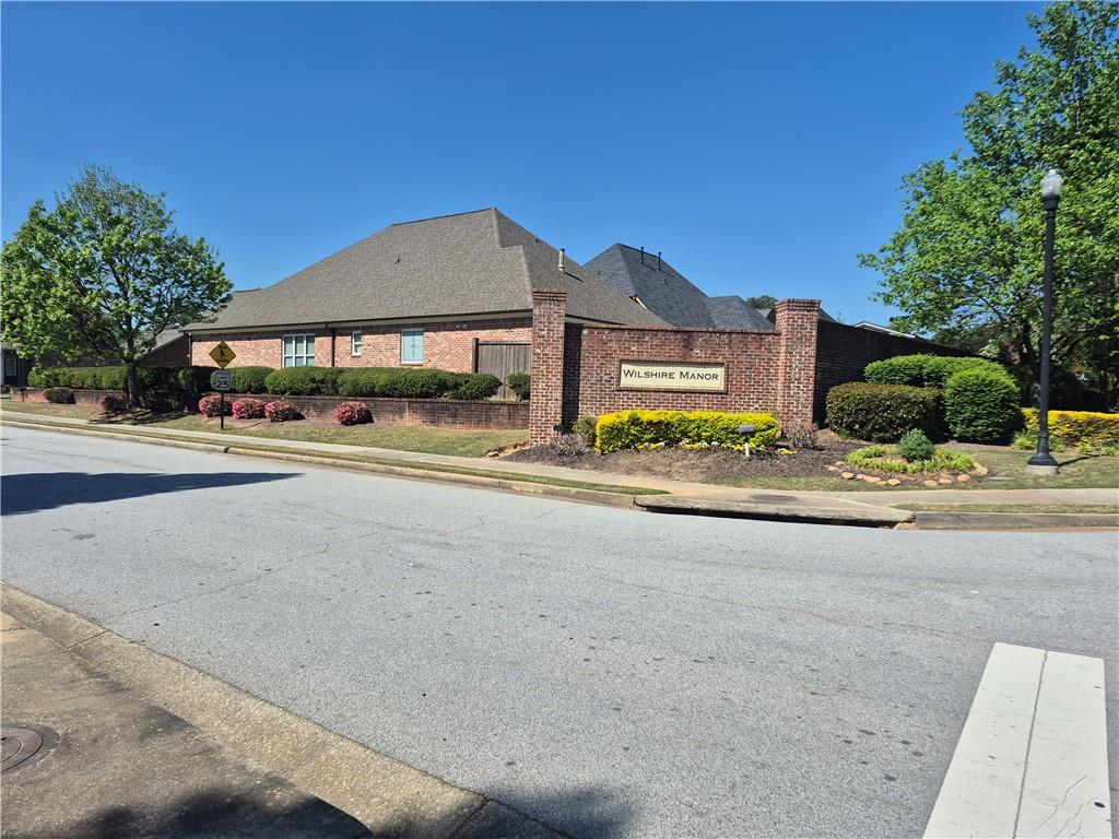 2269 Reddy Farm Lane Grayson, GA 30017 - Photo 46 of 46 a tall building with trees in front of it