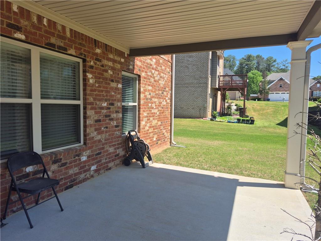 2269 Reddy Farm Lane Grayson, GA 30017 - Photo 7 of 46 a backyard of a house with a garden and outdoor seating