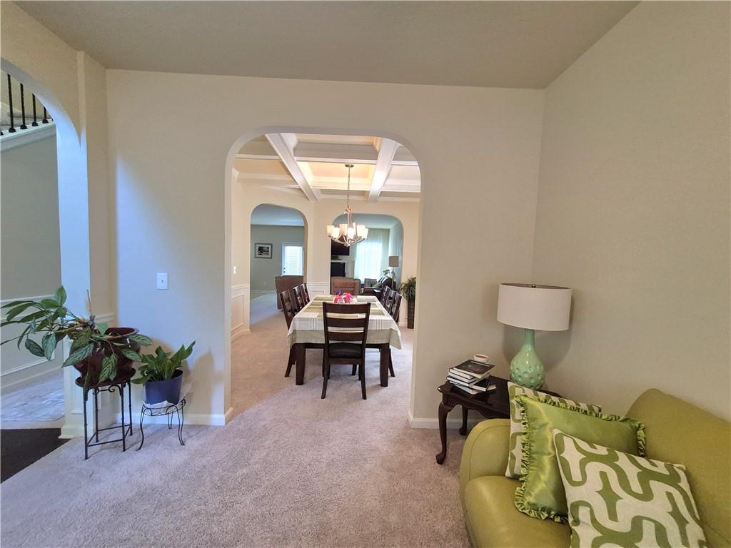 2269 Reddy Farm Lane Grayson, GA 30017 - Photo 8 of 46 a living room with furniture and a potted plant
