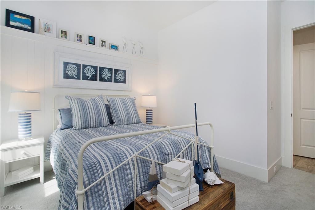 14856 Dockside Lane Naples, FL 34114 - Photo 31 of 50 a bedroom with a bed and a window