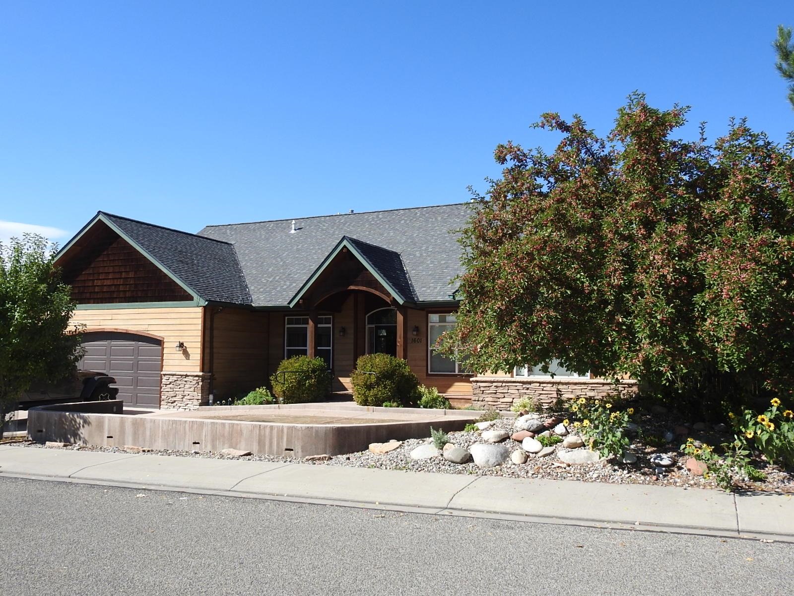 1601 Anvil View Avenue Rifle, CO 81650 - Photo 2 of 35 a front view of a house with a garden