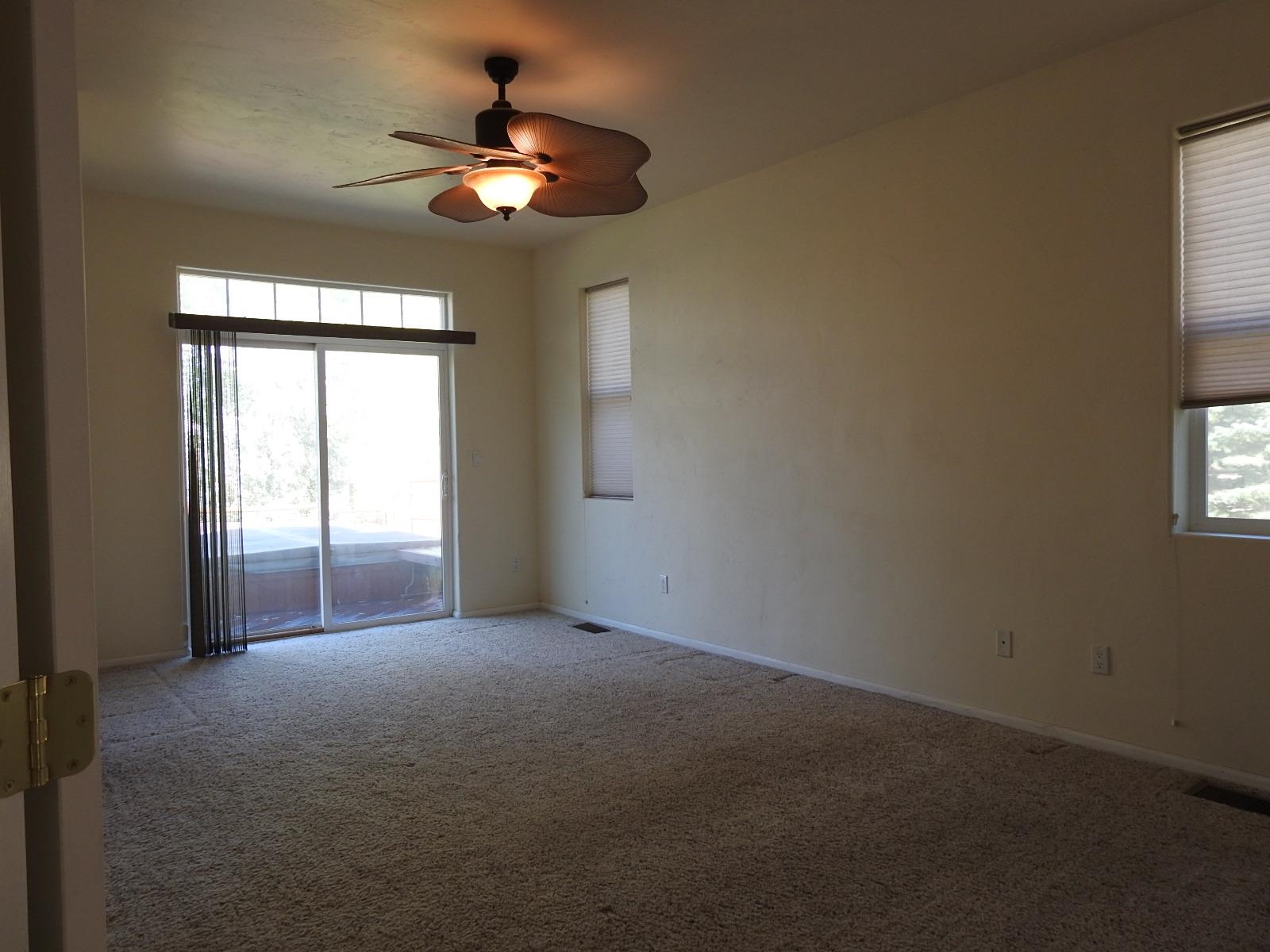 1601 Anvil View Avenue Rifle, CO 81650 - Photo 24 of 35 a view of a livingroom with a ceiling fan and window