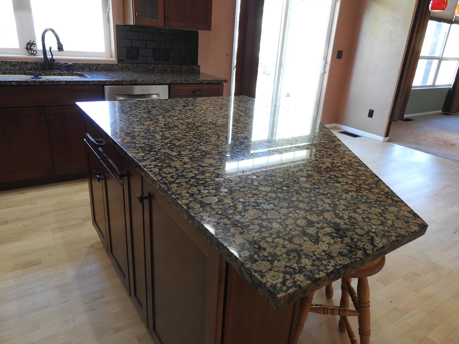 1601 Anvil View Avenue Rifle, CO 81650 - Photo 8 of 35 a kitchen with a granite countertop sink and cabinets