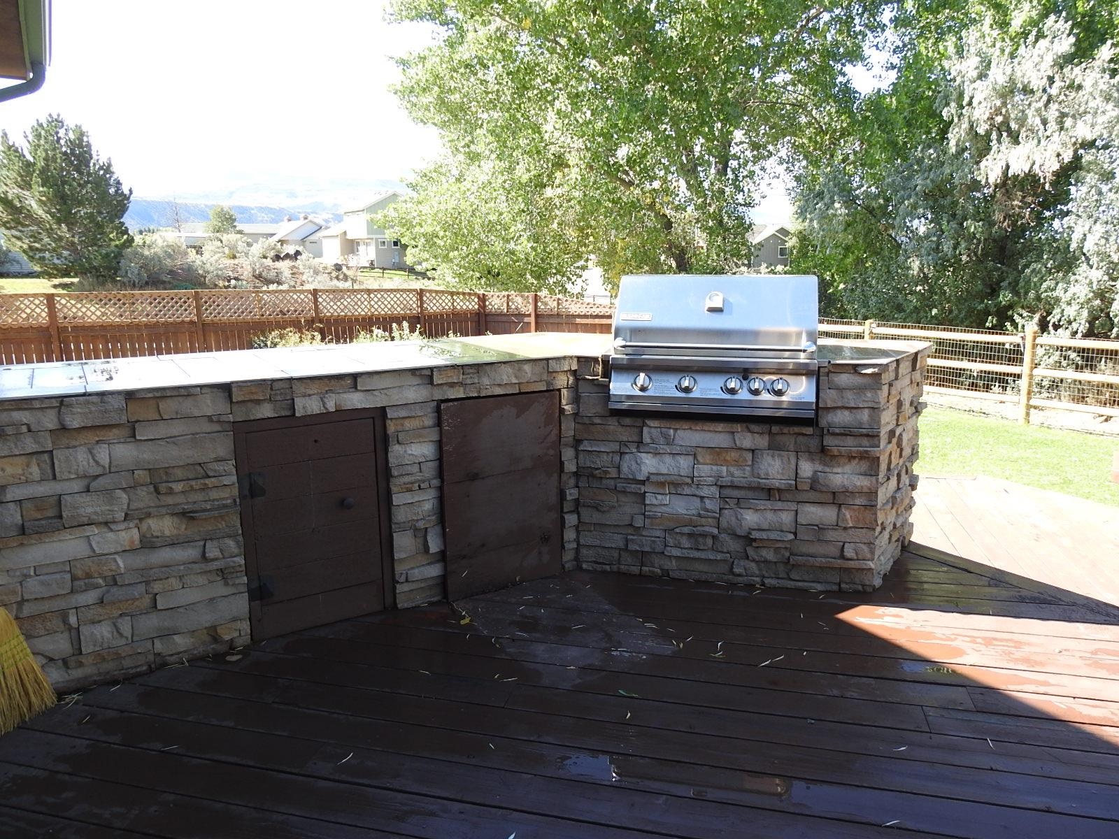 1601 Anvil View Avenue Rifle, CO 81650 - Photo 10 of 35 a view of a kitchen with a wooden floor and a yard