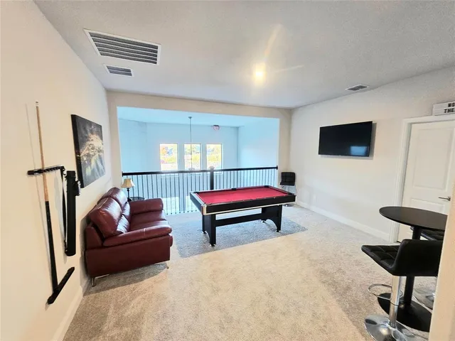 a bedroom with a bed and a mirror