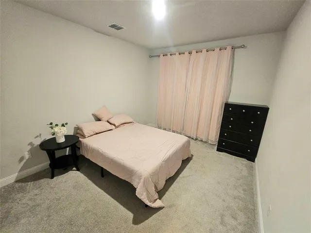 a bathroom with a toilet a sink and a shower