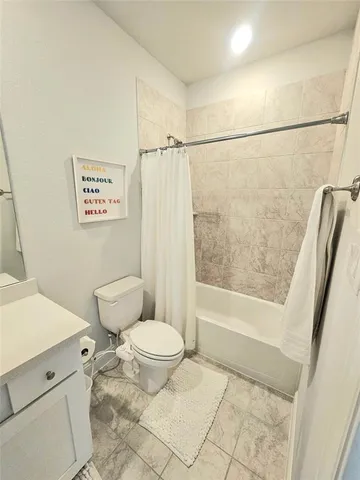 a bathroom with a sink a toilet a mirror and vanity