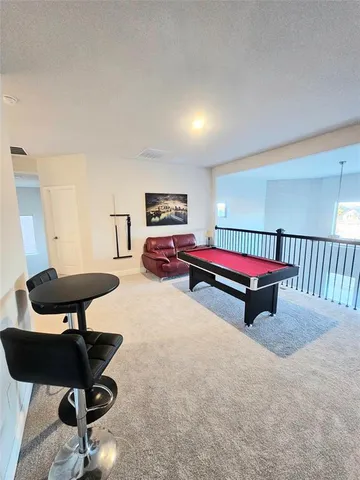 a bedroom with furniture and a bathtub