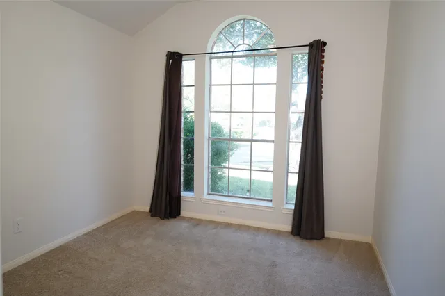 a view of a house with backyard and porch