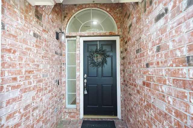 a view of a livingroom with wooden floor and a window
