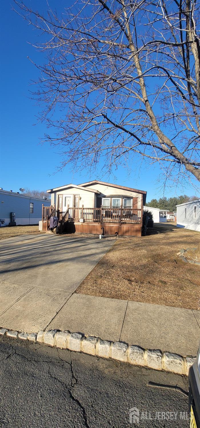 a view of street with a car parked on the road